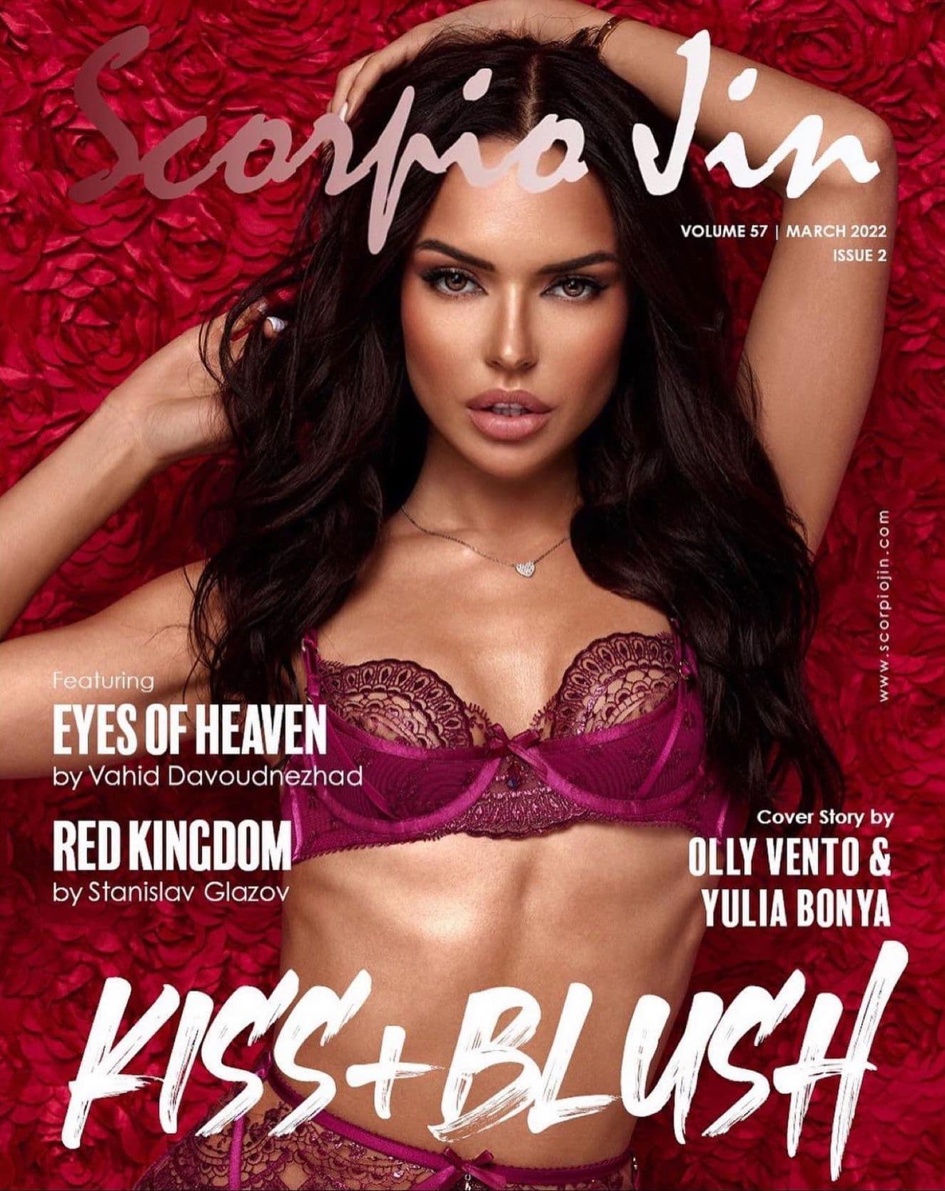 Magazine cover featuring a model with long, dark hair and a red floral background.
