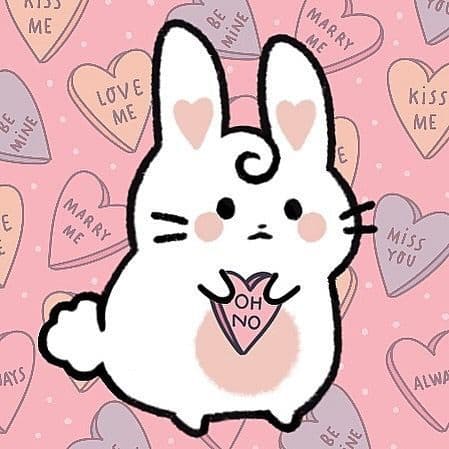 The Anxiety Bun character holding a candy heart that says "OH NO" against a background of Valentine's hearts.