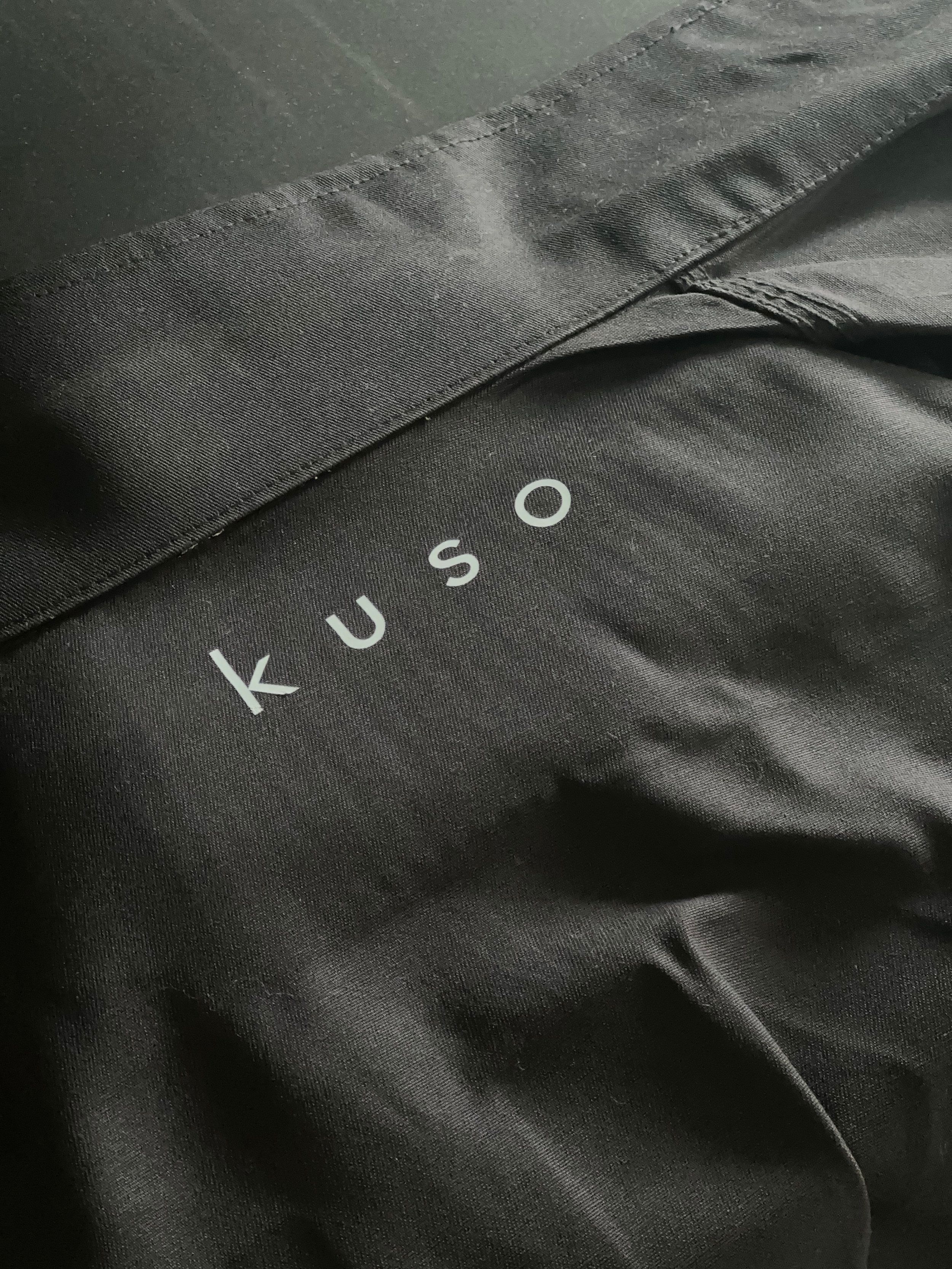 Black fabric with the brand name 'Kuso' printed in white.
