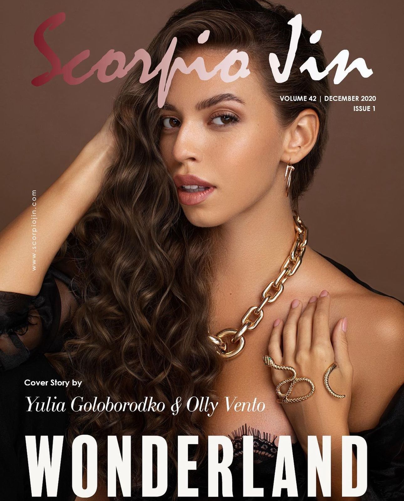 Scorpio Jin magazine cover featuring model with long curly hair, gold jewelry, and 'Wonderland' headline.