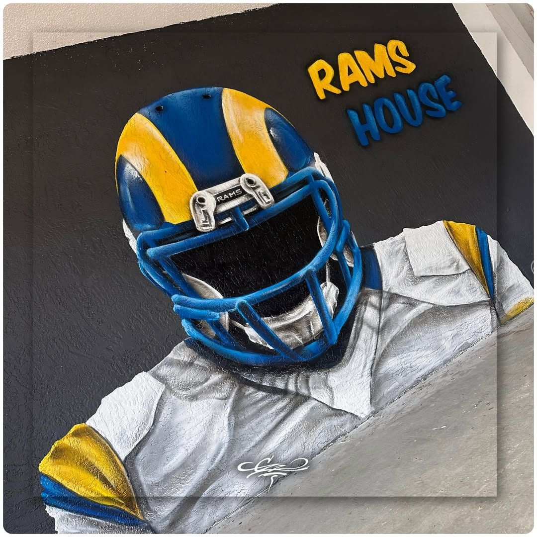 A custom wall mural of a Los Angeles Rams football player with 3D text reading RAMS HOUSE on a black background.